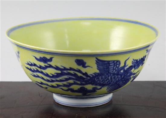 A Chinese yellow ground dragon and phoenix bowl, Xuande six character mark and possibly of the period, 19.5cm, museum restoration, sc